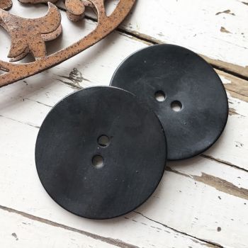 LARGE BLACK HAMMERED BUTTON